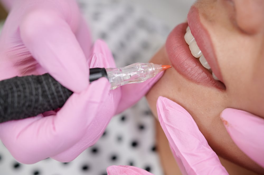 Woman getting permanent lip blush makeup in Ashburn, VA